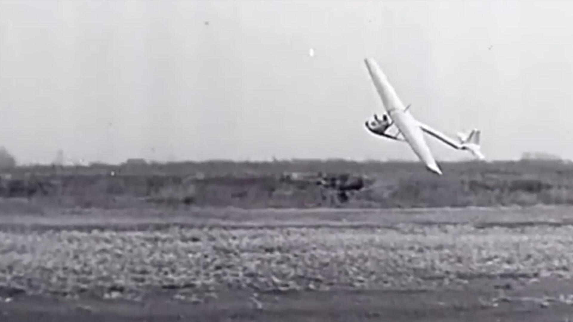 Archival photo of an early aircraft on the ground after a hard landing